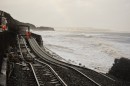 The rail track at Dawlish suspended above the sea where the wall has fallen victim to the storms.  

February 2014