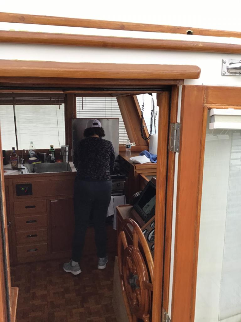 Cara in the galley: A delicious meal of chicken cacciatore being cooked by the galley cook