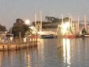 Oriental,  NC, Nov 3: Moon rising over the shrimp boats in the harbor