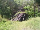 Part of the sugan can railroad.  Much of it still exists and when a cruise ship is in, you can ride it most of the way around the island.