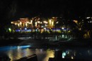 The pool and restaurant at night