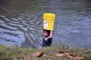 This little girl was carrying 5 gallons of water on head - that