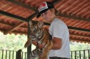 Only in Mexico can a boy hold a Tiger.  Only in Mexico can a Tiger bite the boy.  Mom, he lived!
