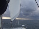 Rain storms in the distance and reduced sail on a stormy day entering Fort Lauderdale 102311