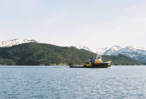 Barge-02-01: Tug pulling a barge outside of Whittier, AK.