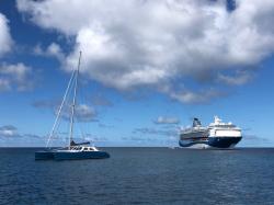 Skylark, one of our sister ships, with a cruise ship in the background: in Port Elisabeth, Bequia