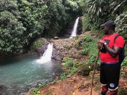 Aaron, our guide, looking at the Seven Sisters waterfall: A great hike in Grenada and a great swim!