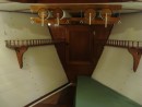 The finished view, with the shelf lashing eyes in place and one of the bunk cushions partially re-covered. 