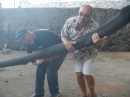 Paul and Dave taking the ox yoke at rum distillery
