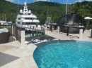 Luxurious hotel pool with megayachts in Marigot Bay St Lucia 
