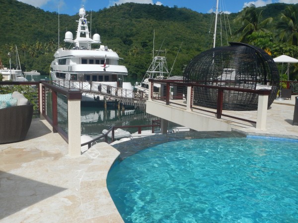 Luxurious hotel pool with megayachts in Marigot Bay St Lucia 