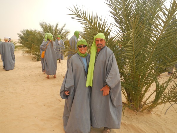Dressed up as Bedouins to ride camels in desert