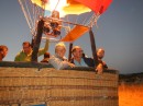 Taking flight in hot air balloon in pre-dawn 