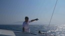 Skipper points at Cabo de Morte