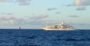Superyacht Chopi Chopi with Adventurer of the seas approaching Antigua