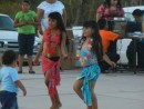 Two very cute little girls doing a polynesian dance.