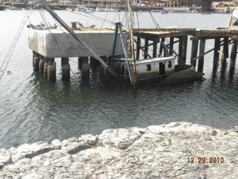 Santa Rosalia old dock with sunk boat