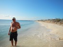 Normans Cay. Steve walking a beach.