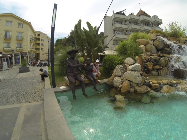 Chris is desperate, even trying to learn how to fish in a fountain in Marmaris.