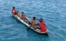 The indians paddle up to the boat to deliver our cruising permit, for $10