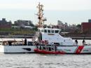 Many coast guard vessels armed and ready on the East River, New York City.