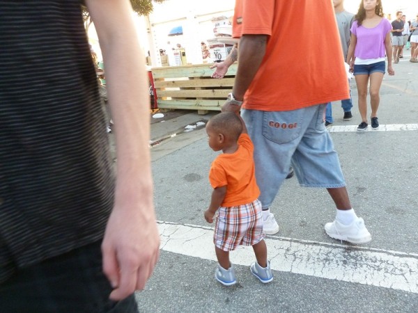 Cute little boy at the Seafood Festival with his dad at Morehead City, North Carolina, USA