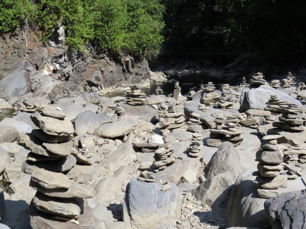 These inukshuk are monuments made of unworked stones that are used by the Inuit for communication or survival in the Canadian Artic.  However, they are now found all over Canada and elsewhere.  Coaticook, QC, Canada.