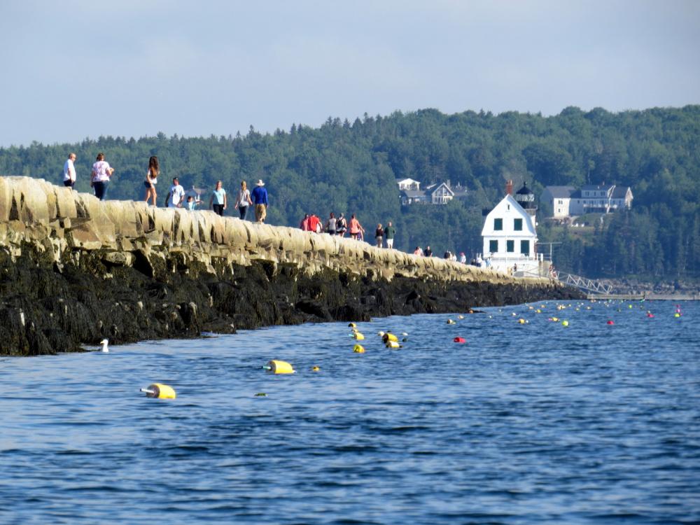 Lobster pot buoys line both sides of the Rockland Breakwater, Rockland, Maine, USA
