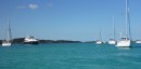 Many boats anchored at Allen Cay near the iguanas