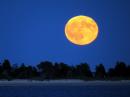 A harvest moon rising this evening at Orient, New York, USA