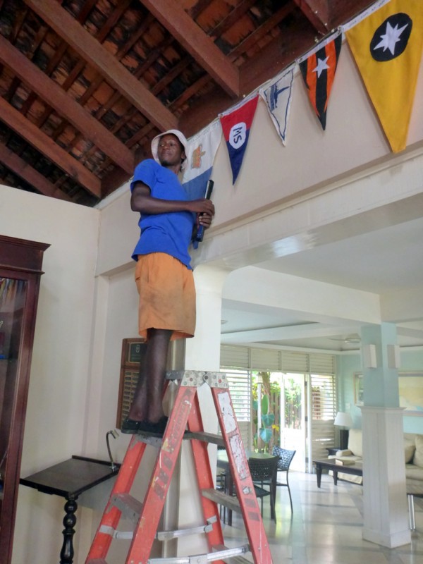 Striking a pose while hanging our RQYS Burgee in the Montego Bay Yacht Club, Jamaica.  If anyone arrives at the Club by sea, please take a picture and send to us.  We