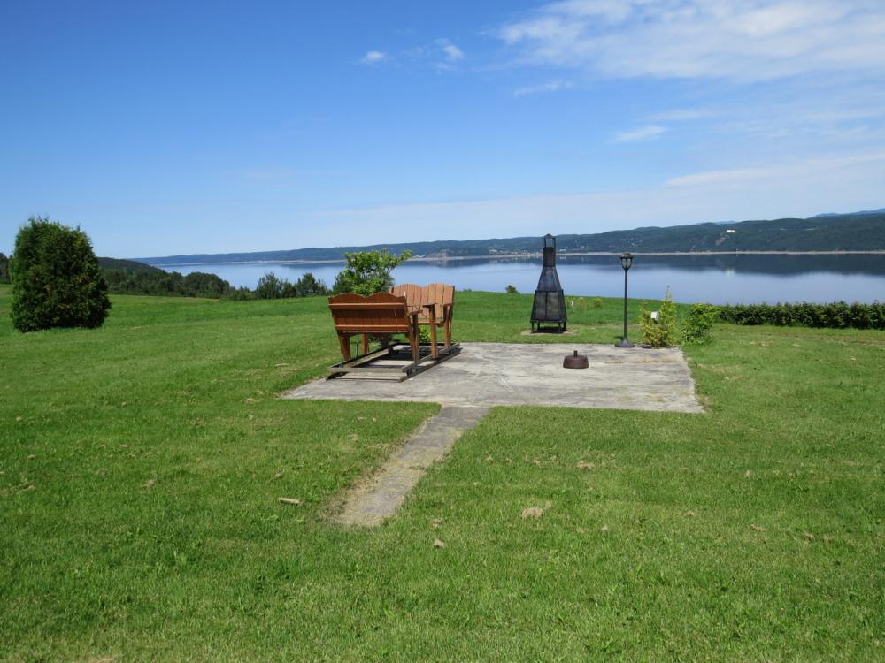 Imagine sitting here overlooking the fjord with a fire going in winter at this private home. Saguenay, QC, Canada.
