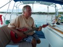 Chris Hansen on his guitar on board Picaro