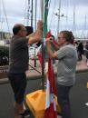 Captains are fixing the flag to be raised at the Marina