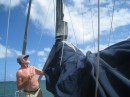 Scott checking out how our 2nd extension looked.  It gave him 8 more inches of sail cover at the mast to cover our larger cruising sail vs the racing sail.