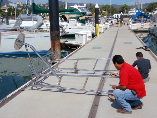 Newly farbicated arch for the new solar panels arrives on the dock at La Cruz, February, 2012.