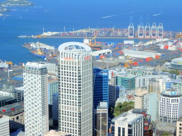 Looking down on the Auckland skyscrapers, with the commercial docks in the background.