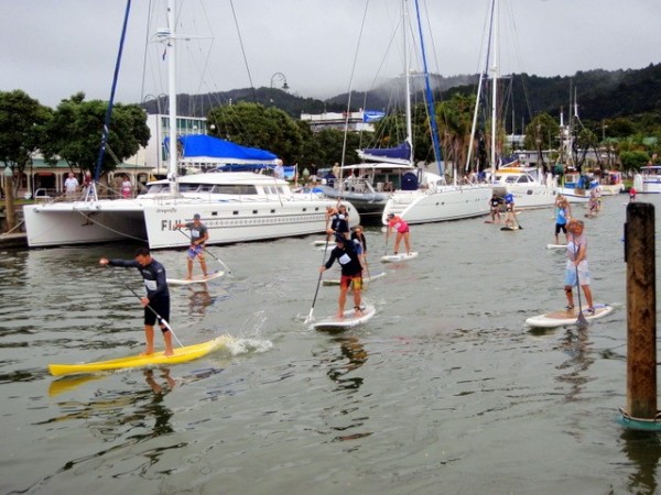 Paddle boarding is very popular in New Zealand; here some paddle board racers head downriver past Bright Angel.