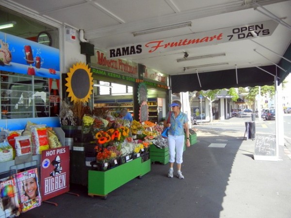 Anne (SV Blue Rodeo) checks out the fresh cut flowers in this Ponsonby sidewalk display