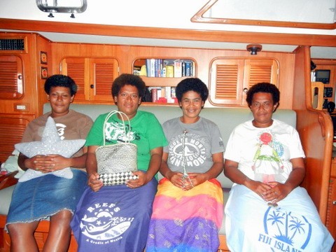 From left to right - So, Nessi, Jasmine and Koro. So, Jasmine and Koro are holding things of ours they found in the cabin that must have fascinated them; Nessi is holding a woven purse that Koro brought to give Linda.