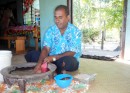 George, one of the school teachers at the primary school on Fulanga. George, who is from Cicia (pronounced "Thithia"), an island further north in the Lau Group, is mixing a bowl of kava, a mildly intoxicating traditional drink made from the root of a pepper plant.