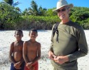 A couple of young guys join Bob for his walk on the beach.