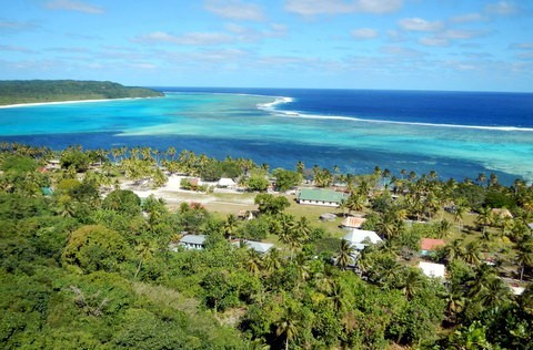 View of the village, the reef, and the open ocean beyond from the hill high above Maunaithaki.