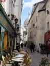 Pretty street view with Sacre Coeur visible.