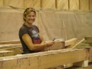 Gail, 1st mate on the Bluenose stands amidst the new laminated frames for Bluenose at Covey Island Boatworks in Riverport