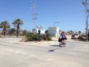 Richard cycling home from the market - check out the funny creature in the middle of the roundabout