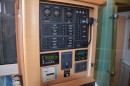 Main electrical panel. Smaller panels are for inverter control, solar panel charge controller monitor, generator control, water maker control