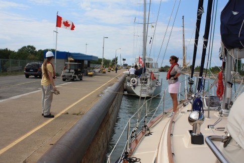 Marjorie chatting with one of the line handlers in Lock 2.  We were held here for about 45 minutes while a freighter was lifted in Lock 1.