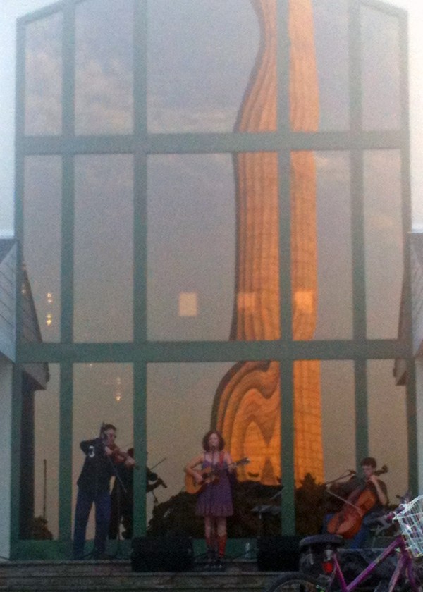 Memorial reflected in the glass wall of the visitors