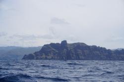 Eastern headlands of Nuku Hiva.  The cliff look like tikis!